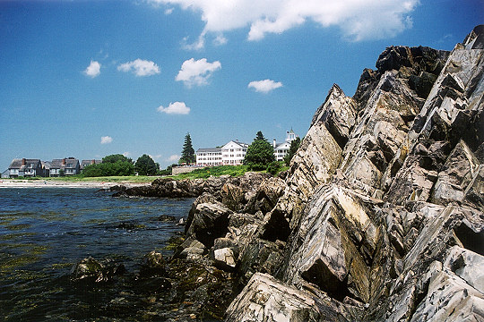 An Oceanside Resort Seen Through Rock Formations Picture